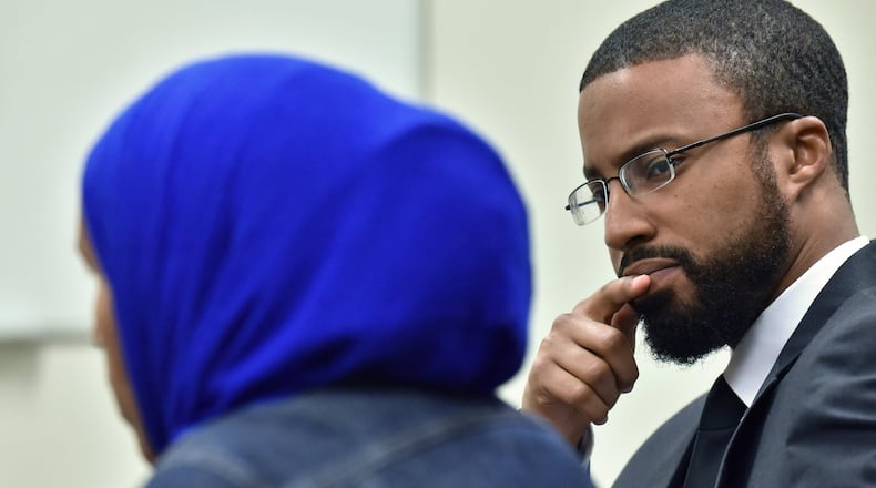 Aisha Hussain, sister of Shukri Ali Said, talks about her sister’s death as Edward Ahmed Mitchell (background), CAIR-GA executive director, looks at her on July 17, 2018. In April, a 36-year-old Muslim American woman, Shukri Ali Said, was shot to death by Johns Creek police after they say she refused to drop a knife. There have been community memorial events for the woman, who suffered from mental illness. HYOSUB SHIN / HSHIN@AJC.COM