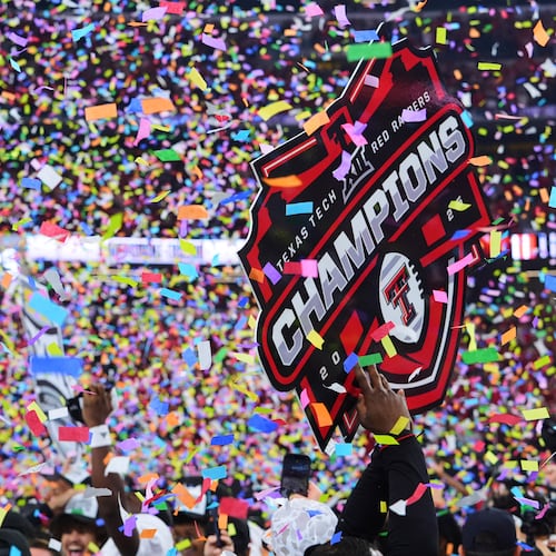 FILE - Texas Tech team and staff celebrate their win against BYU in the Big 12 Conference championship NCAA college football game Saturday, Dec. 6, 2025, in Arlington, Texas. (AP Photo/Julio Cortez,File)