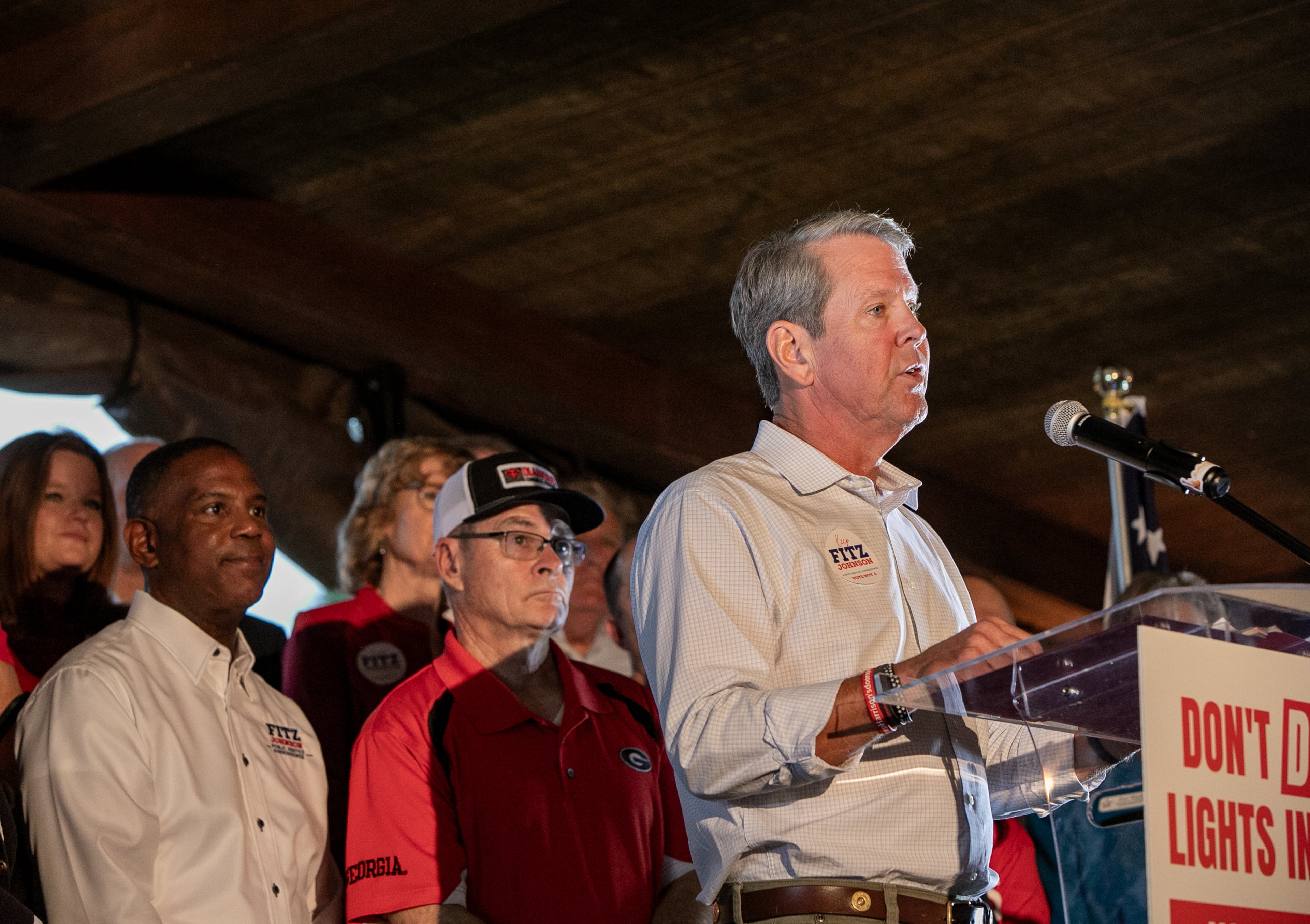 Commissioners Tim Echols and Fitz Johnson campaign with support from Gov Brian Kemp at a rally in Cumming at Reid Barn on Oct 7, 2025. (Jenni Girtman for the AJC)
