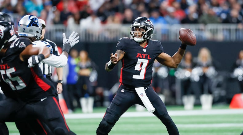 Atlanta Falcons quarterback Michael Penix Jr. (9) attempts a pass during the second half of an NFL football game against the Caroline Panthers on Sunday, January 5, 2025, at Mercedes-Benz Stadium in Atlanta. 
(Miguel Martinez/ AJC)