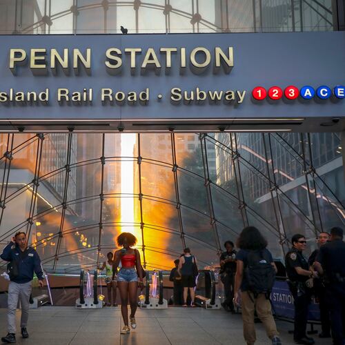 FILE - Commuters pass Penn Station and Madison Square Garden, July 2, 2026, in New York. (Photo by Andy Kropa/Invision/AP, File)