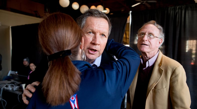 Republican presidential candidate, Ohio Gov. John Kasich is greeted by supporters as he arrives to speak at a town hall at The Hall at Senate's End in Columbia, S.C. on Friday. AP/Andrew Harnik