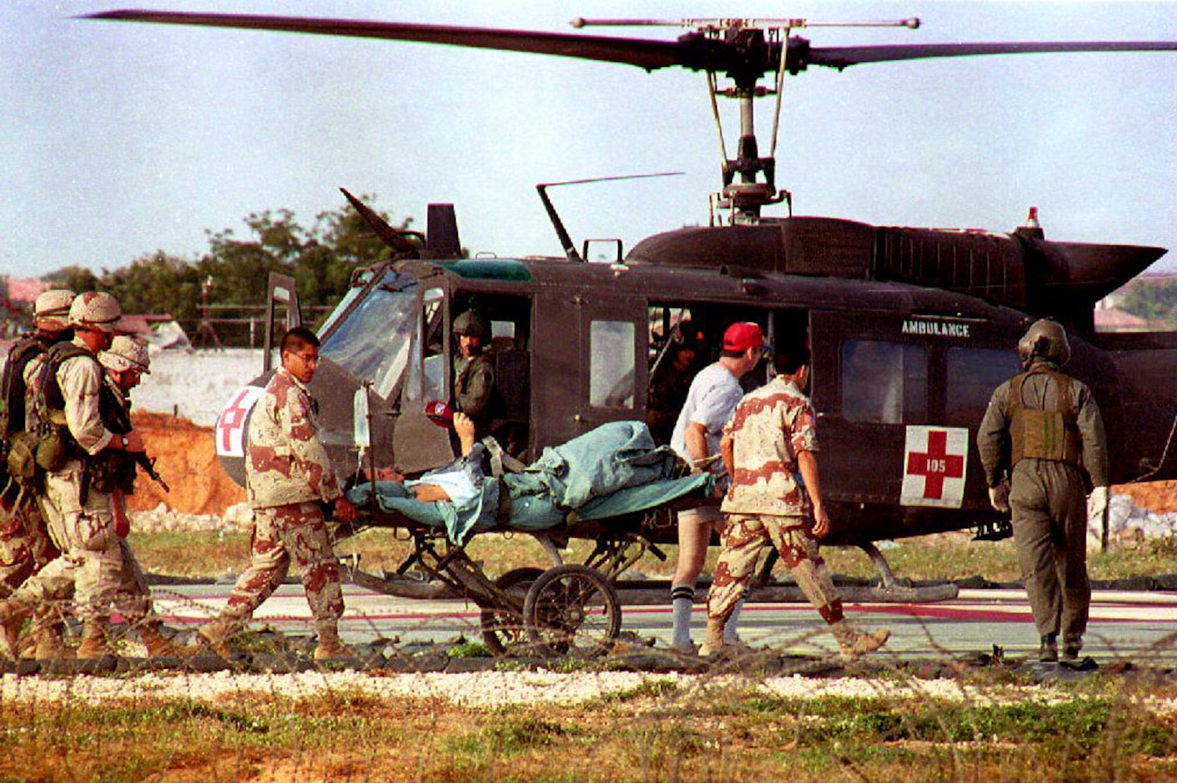 U.S. helicopter pilot Michael Durant is carried on a stretcher to the helicopter from the 46th Combat Support hospital. (Hocine Zaourar/AFP via Getty Images 1993)