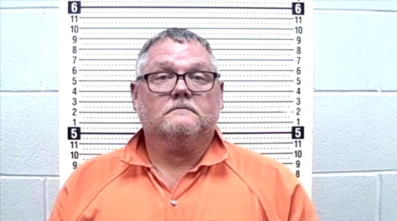 Brian Dennis Adams, former Smith State Prison warden, faces charges in a GBI corruption investigation into the prison.