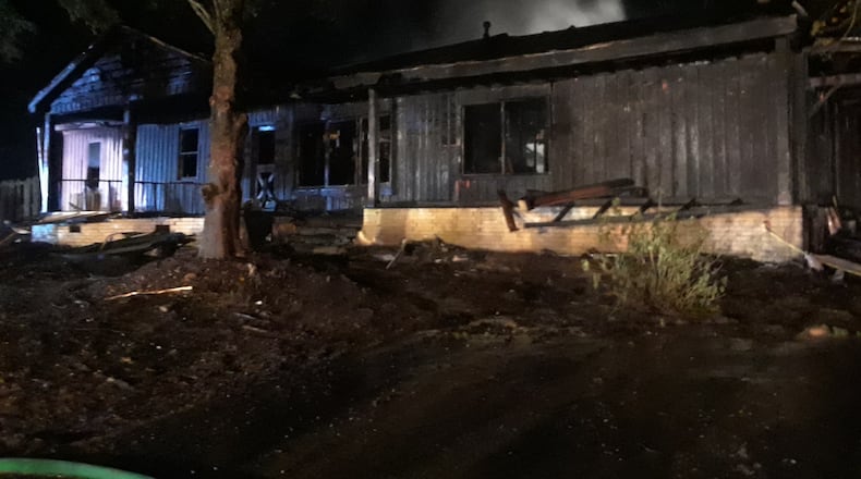 Four people were inside the Gwinnett County home when it caught fire.