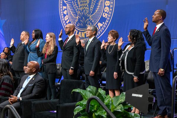 Members of the City Council of Atlanta are sworn in during the national anthem at the inauguration day ceremony at Georgia State University Convocation Center in Atlanta on Monday, Jan. 5, 2026. (Arvin Temkar/AJC)