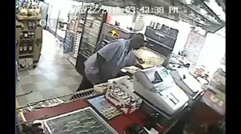 Photo of man hitting quarters game with sledgehammer