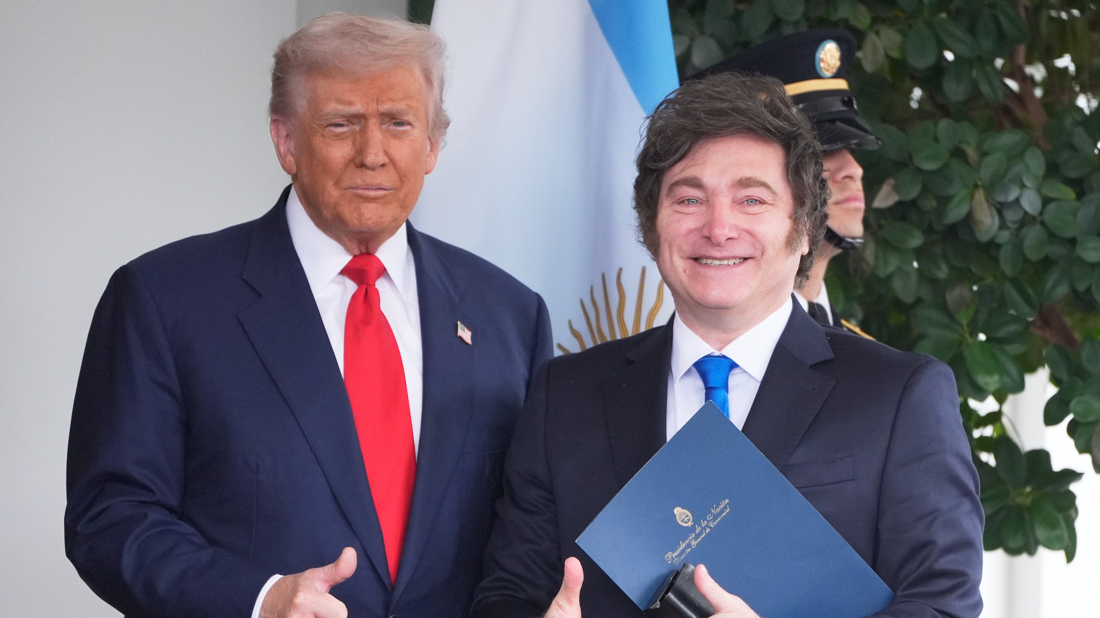 President Donald Trump greets Argentina's President Javier Milei, as he arrives at the White House, Tuesday, Oct. 14, 2025, in Washington. (AP Photo/Mark Schiefelbein)