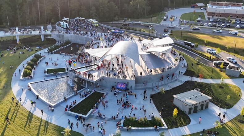Suwanee’s Town Center on Main and DeLay Nature Park features an elevated bridge, a large lawn for events and recreation, a veterans monument, two ponds and a beach volleyball court. (Photo Courtesy of Lee Heard)