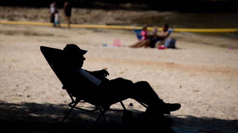 Relaxing on a beach at Lake Lanier last year on Labor Day, aka the “last day of summer.”  BRANDEN CAMP/SPECIAL