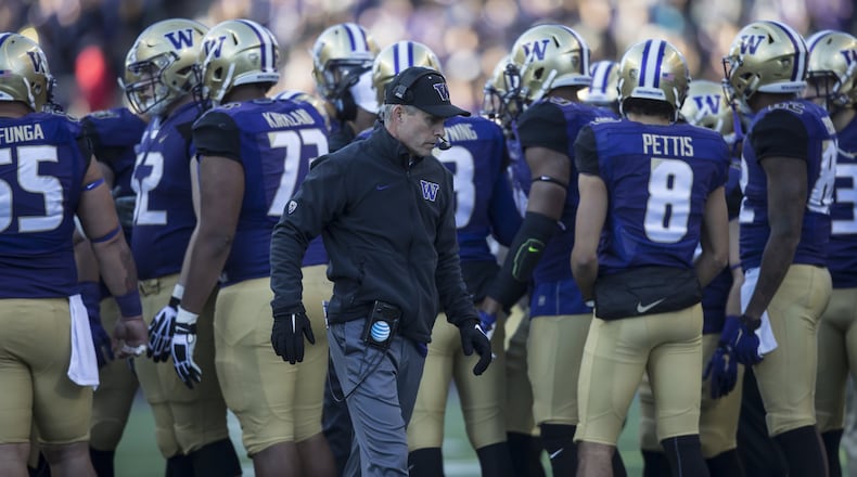 Chris Petersen is in his third season as the Washington Huskies’ head coach. (File photo by Stephen Brashear/Getty Images)