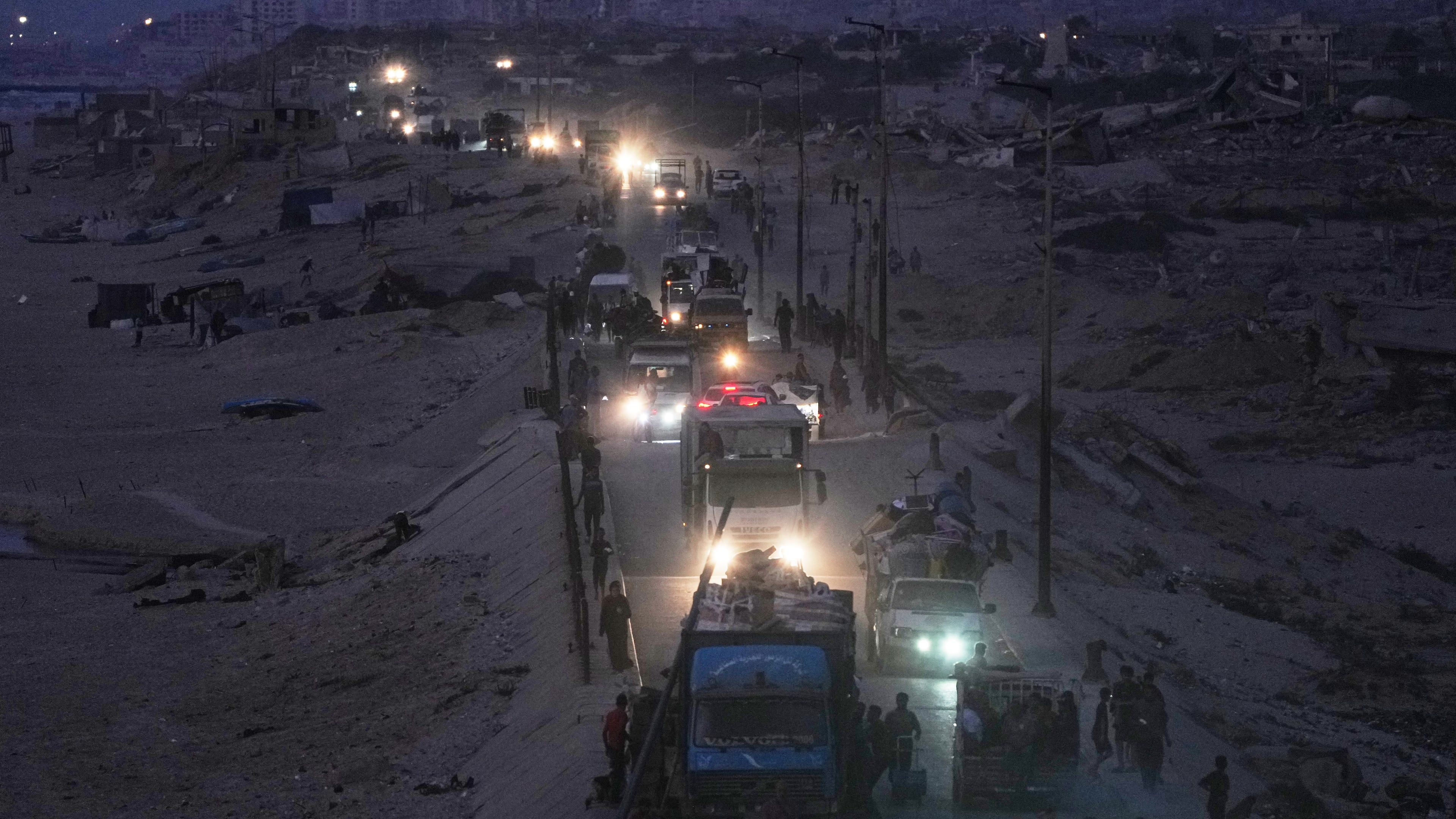 Displaced Palestinians flee northern Gaza, by vehicle and on foot, carrying their belongings along the coastal road near Wadi Gaza, Friday, Sept. 26, 2025. (AP Photo/Abdel Kareem Hana)