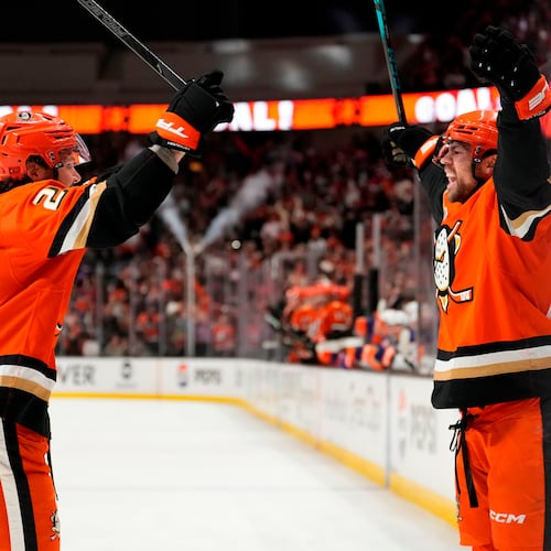 Anaheim Ducks center Ryan Poehling, right, celebrates his goal with center Mason McTavish during the first period of Game 6 in the first round of the NHL hockey Stanley Cup playoffs series against the Edmonton Oilers, Thursday, April 30, 2026, in Anaheim, Calif. (AP Photo/Mark J. Terrill)