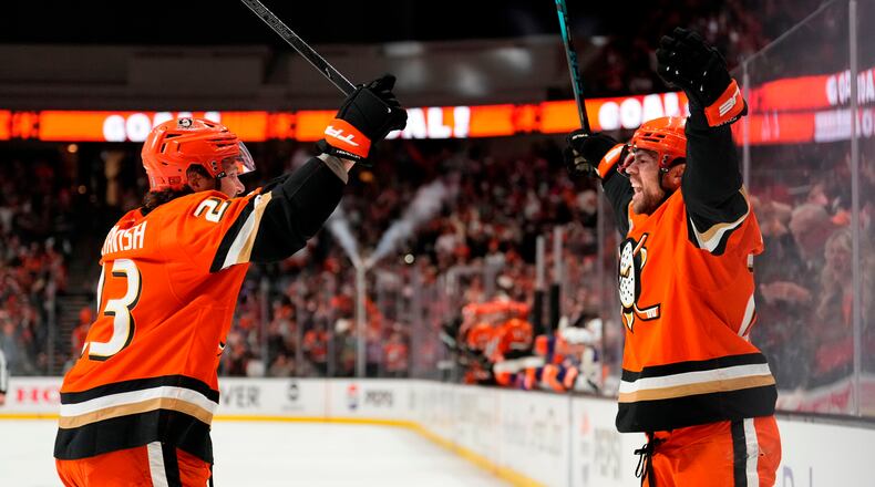 Anaheim Ducks center Ryan Poehling, right, celebrates his goal with center Mason McTavish during the first period of Game 6 in the first round of the NHL hockey Stanley Cup playoffs series against the Edmonton Oilers, Thursday, April 30, 2026, in Anaheim, Calif. (AP Photo/Mark J. Terrill)