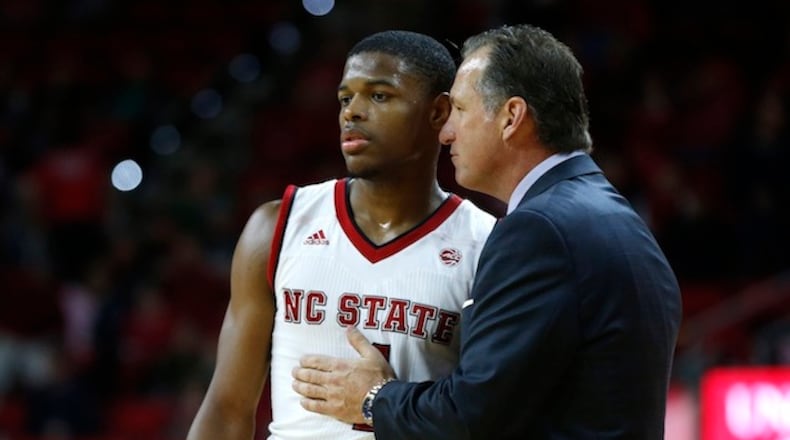 North Carolina State head coach Mark Gottfried talks with Dennis Smith Jr. (4) in the second half against Boston University at PNC Arena in Raleigh, N.C., Saturday, Dec. 3, 2016. Smith will make his pro debut during the NBA Summer League 2017 in Las Vegas, Nev. (Ethan Hyman/Raleigh News & Observer/TNS)