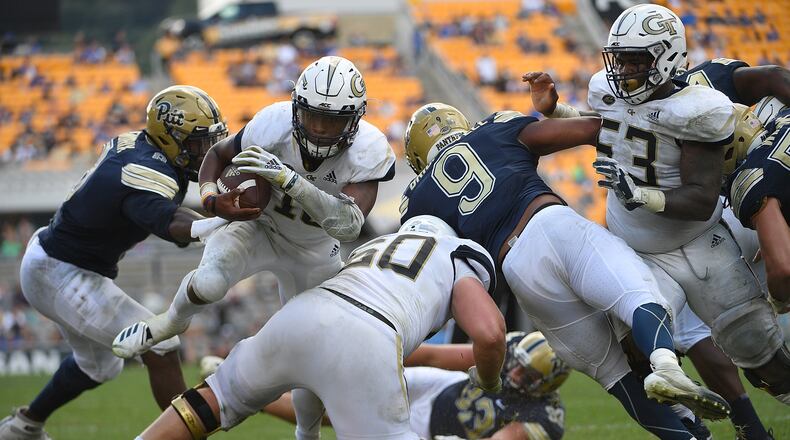 PITTSBURGH, PA - SEPTEMBER 15: TaQuon Marshall #16 of the Georgia Tech Yellow Jackets dives into the end zone for a 7 yard touchdown in the fourth quarter during the game against the Pittsburgh Panthers at Heinz Field on September 15, 2018 in Pittsburgh, Pennsylvania. (Photo by Justin Berl/Getty Images)