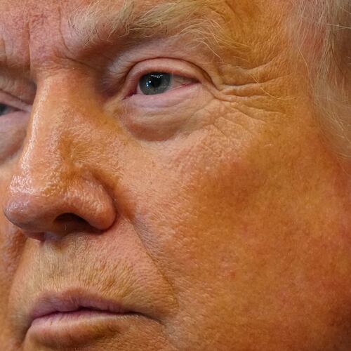 President Donald Trump listens after signing executive orders modifying the Bears Ears National Monument and the Grand Staircase-Escalante National Monument in the Oval Office of the White House, Monday, July 13, 2026, in Washington. (AP Photo/Julia Demaree Nikhinson)