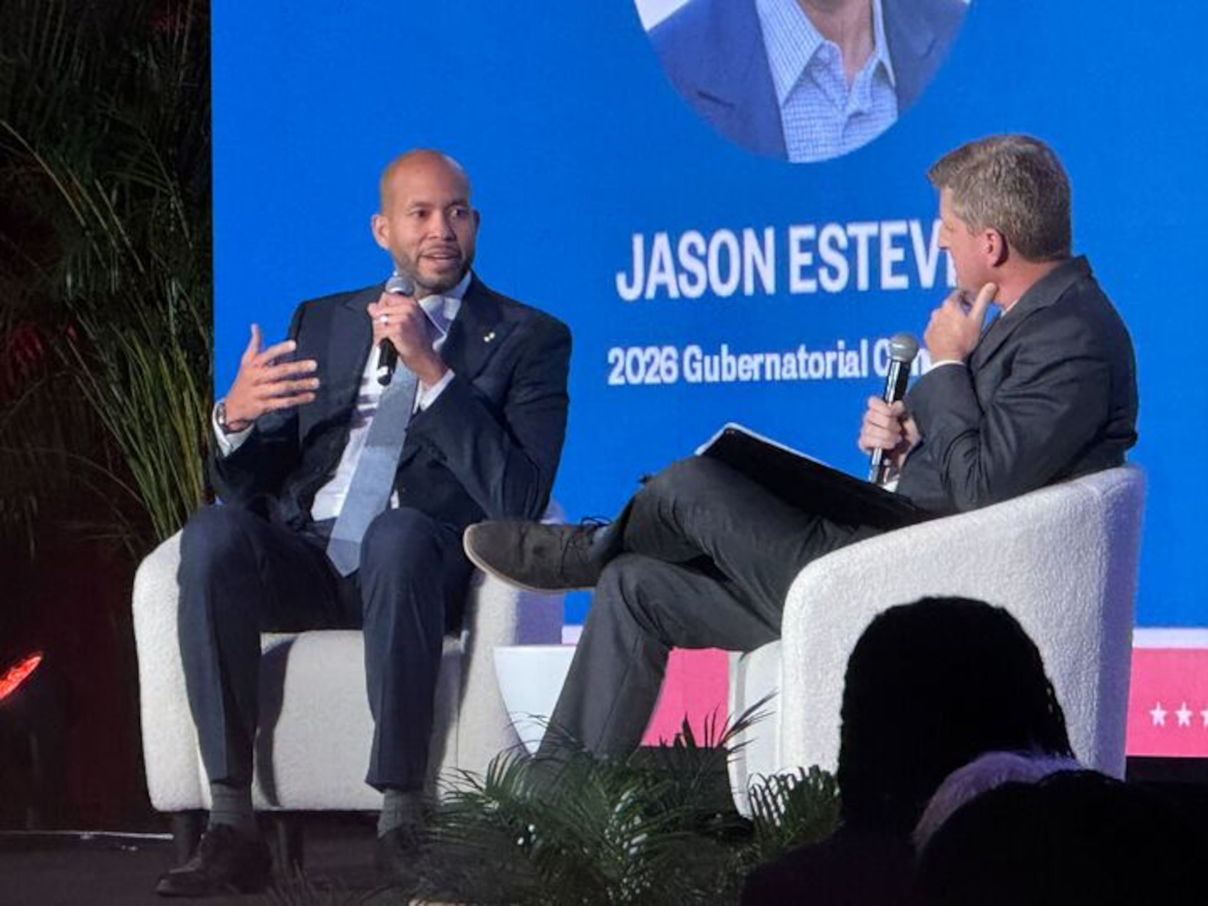 Democratic gubernatorial candidate Jason Esteves (left) spoke to the AJC's Greg Bluestein at a recent Politically Georgia forum in Atlanta. ( Adam Beam/AJC)