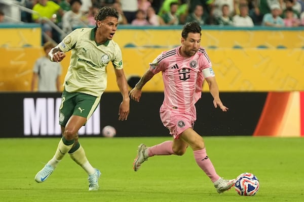 Inter Miami's Lionel Messi controls the ball chased by Palmeiras' Richard Rios during the Club World Cup Group A soccer match between Inter Miami and Palmeiras in Miami Gardens, Fla., Monday, June 23, 2025. (AP Photo/Lynne Sladky)
