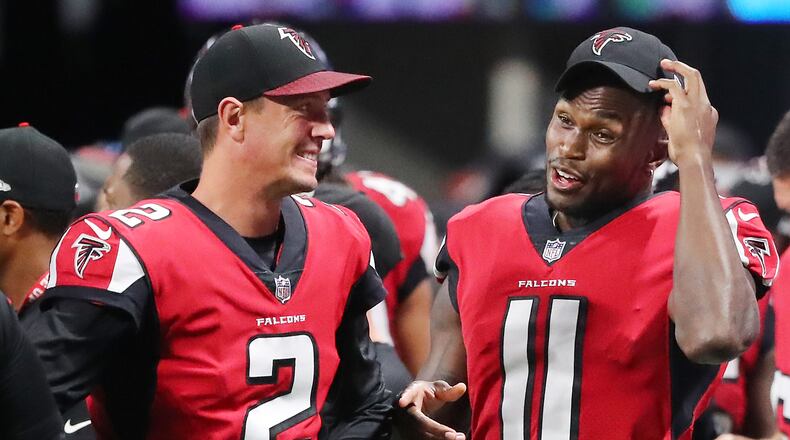 August 31, 2017 Atlanta: Falcons quarterback Matt Ryan and wide reciever Julio Jones, who both did not play in the game, share a laugh on the sidelines during the 4th quarter of their final preseason game against the Jaguars in a NFL football game on Thursday, August 31, 2017, in Atlanta.    Curtis Compton/ccompton@ajc.com