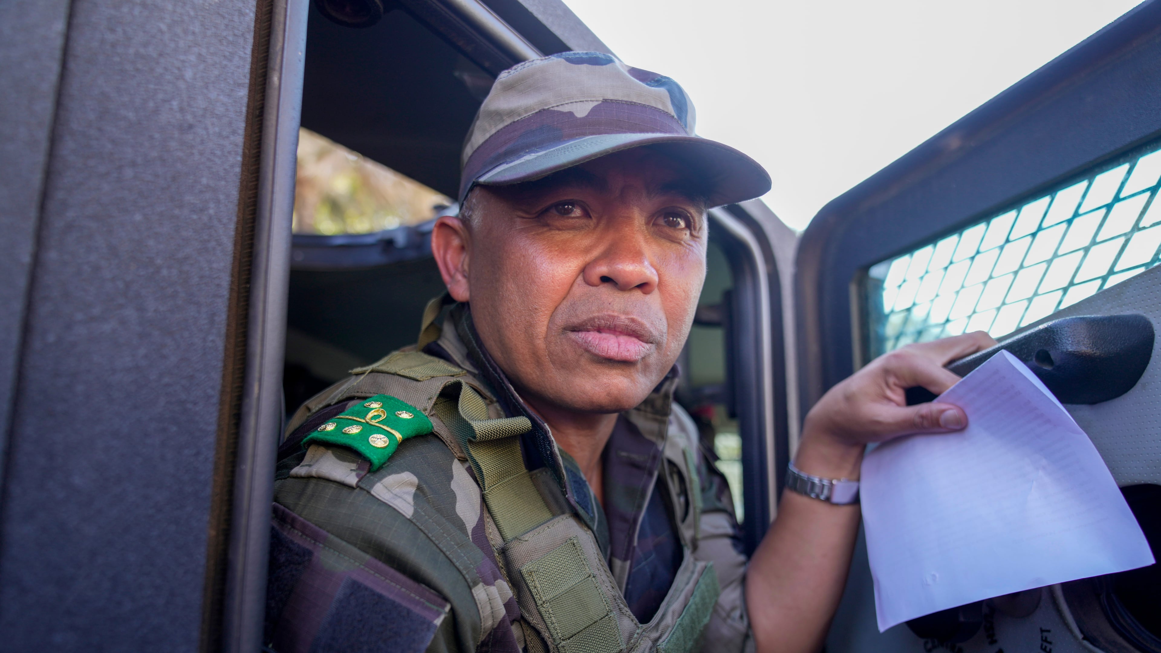 CAPSAT military unit commander Col. Michael Randrianirina and his troops make their way to the Presidency to announce that the armed forces are taking control of the country in Antananarivo, Madagascar, Tuesday, Oct. 14, 2025. (AP Photo/Brian Inganga)