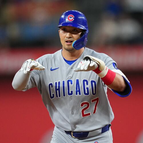 Chicago Cubs' Seiya Suzuki gestures while running the bases after hitting a two-run home run off Texas Rangers starting pitcher Kumar Rocker during the fourth inning of a baseball game Friday, May 8, 2026, in Arlington, Texas. (AP Photo/Julio Cortez)