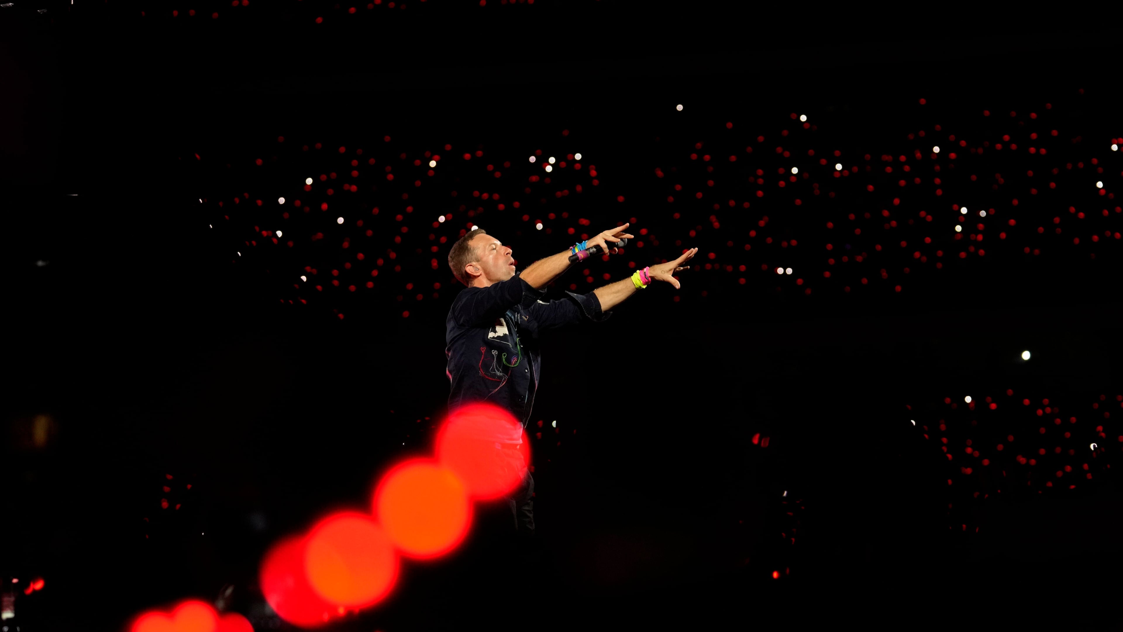 FILE - Chris Martin of Coldplay performs during the band's Music Of The Spheres World Tour at D. Y. Patil Sports Stadium in Navi Mumbai, Saturday, Jan. 18, 2025. (AP Photo/Rajanish Kakade, File)