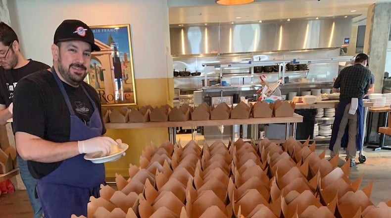 Using products from local farmers, employees at Forza Storico prep meals for the Atlanta Healthcare Heroes program. Staff at that restaurant, and Miller Union, are preparing 4,000 meals a week for health care workers through a program funded by the Atlanta Hawks. CONTRIBUTED BY MICHAEL PATRICK