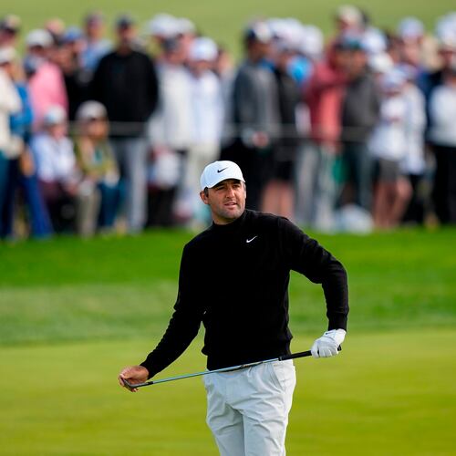 Scottie Scheffler watches his shot on the 10th green during the second round of the PGA Championship golf tournament at Aronimink Golf Club, Friday, May 15, 2026, in Newtown Square, PA. (AP Photo/Matt Slocum)
