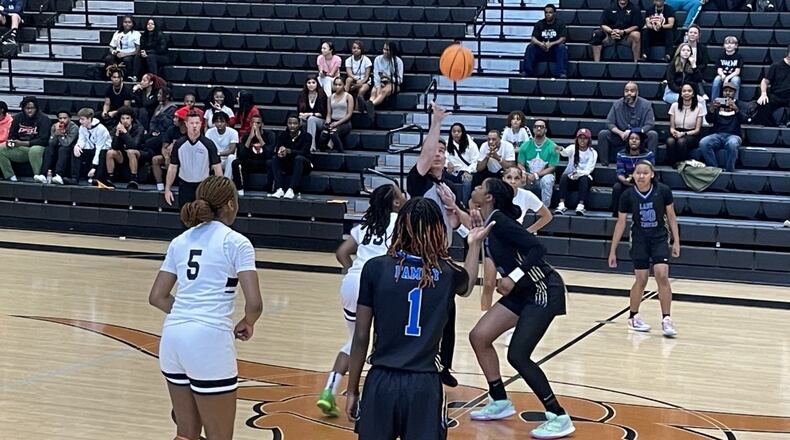 Kell's Jamiah Gregory (23) and Bradwell Institute's Ja'Nya Bush go up for the jump ball to start their Class 5A quarterfinal game at Kell on Feb. 28, 2023. Kell won 68-54 to reach the semifinals for the third time in four seasons.