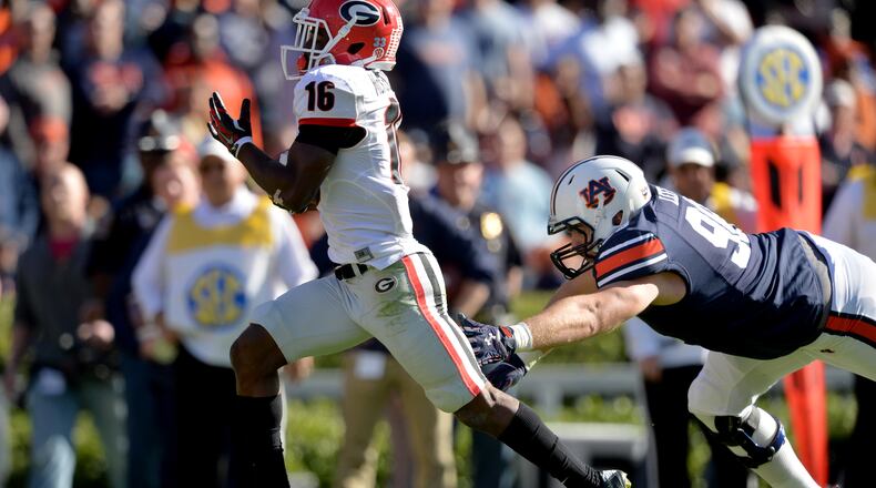 Georgia's Isaiah McKenzie returns a punt for a touchdown against Auburn in 2015. BRANT SANDERLIN/BSANDERLIN@AJC.COM