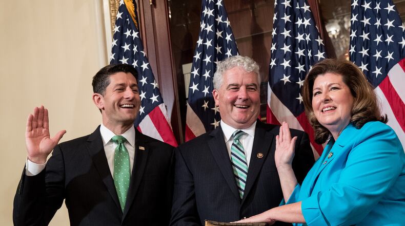 U.S. House Speaker Paul Ryan, from left, Steve Handel and U.S. Rep. Karen Handel, R-Ga., participate in a ceremonial swearing-in Monday on Capitol Hill. (Photo by Drew Angerer/Getty Images)