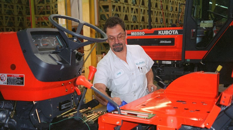 Kubota said it has begun production at its newest plant in Gainesville. In this undated photo, Kubota employee Greg Smith oversees production of a Kubota tractor in Georgia. (AJC Staff Photo/Peter Kent)