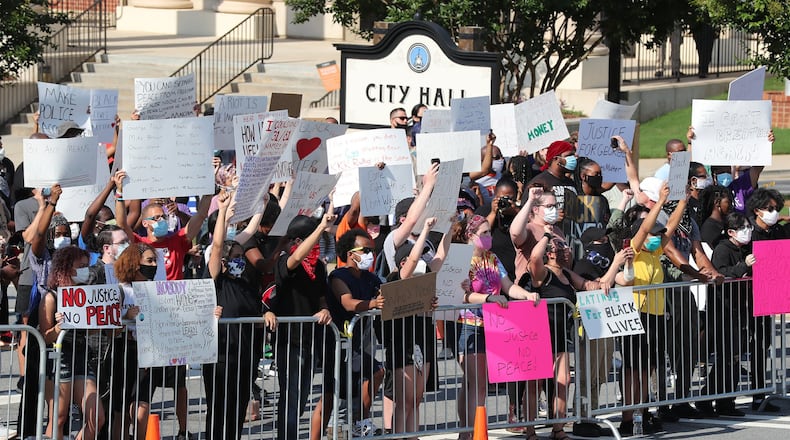 Hundreds of protesters gather outside Lawrenceville City Hall as protests continue for a fourth day around metro Atlanta over the death of George Floyd on Monday, June 1, 2020, in Lawrenceville. Curtis Compton ccompton@ajc.com