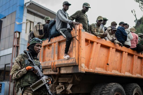 FILE - Former members of the Armed Forces of the Democratic Republic of Congo (FARDC) and police officers who allegedly surrendered to M23 rebels arrive in Goma, Congo, Sunday, Feb. 23, 2025. (AP Photo/Moses Sawasawa, file)