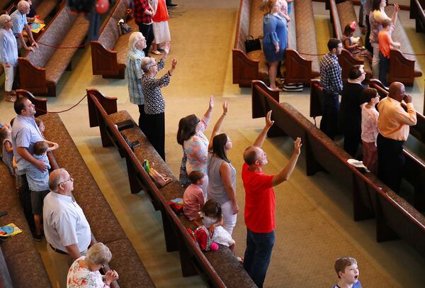 Worshippers keep their distance at the Church at Liberty Square in Cartersville, which resumed Sunday services on Sunday, June 7, 2020, for the first time since closing its doors in March after suffering from a deadly outbreak of the coronavirus disease. (Photo: Curtis Compton / ccompton@ajc.com)