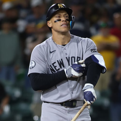 New York Yankees' Aaron Judge reacts after drawing a bases loaded walk to score a run during the ninth inning of a baseball game against the Athletics Saturday, May 30, 2026, in West Sacramento, Calif. (AP Photo/Scott Marshall)