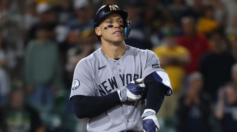 New York Yankees' Aaron Judge reacts after drawing a bases loaded walk to score a run during the ninth inning of a baseball game against the Athletics Saturday, May 30, 2026, in West Sacramento, Calif. (AP Photo/Scott Marshall)