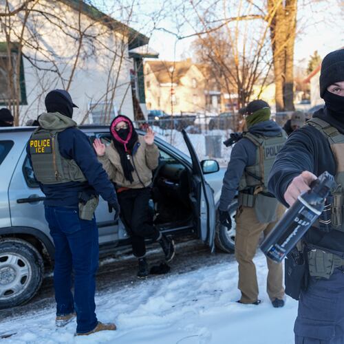Activists are approached by federal agents for following agent vehicles, on Tuesday, Feb. 3, 2026, in Minneapolis. (AP Photo/Ryan Murphy)