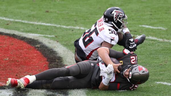 Falcons defensive end Dante Fowler (56) sacks Tampa Bay Buccaneers quarterback Tom Brady (12) during the second half Sunday, Jan. 3, 2021, in Tampa, Fla. (Mark LoMoglio/AP)