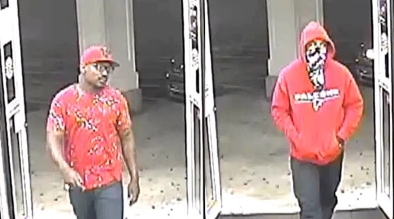 Norcross police are looking for these two men in connection with an armed robbery at a CVS.