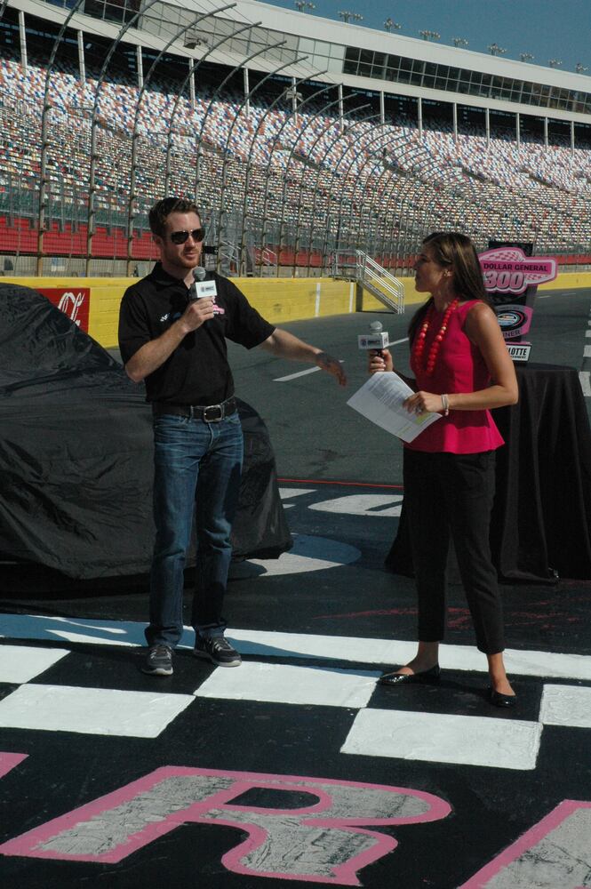 IMAGES: NASCAR drivers, breast cancer survivors paint pit road pink