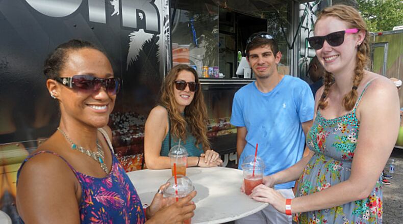 Tracy Cunningham (left), Julia Vaillancourt, Bogdan Gadidov and Marley Pruyn smile for the camera at the first black-owned Atlanta Food Truck Park.