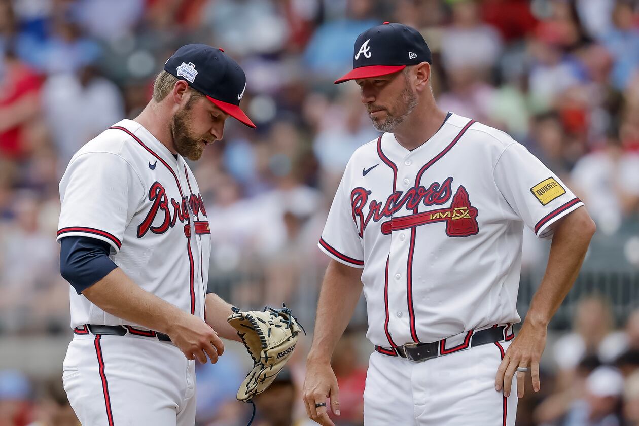 Braves pitcher Bryce Elder (left) — pictured during a mound visit by pitching coach Jeremy Hefner on June 7 against the Pirates — allowed eight runs and 12 hits with two walks in six innings Sunday against the Brewers. (Erik S. Lesser/AP)
