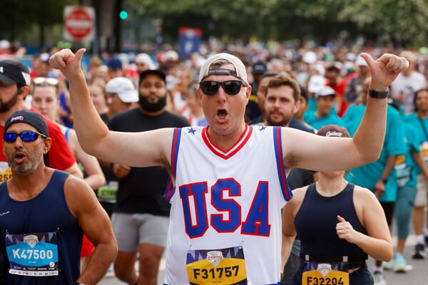 For many runners, Fourth of July festivities began well before the finish line at Saturday's Peachtree Road Race. (Arvin Temkar/AJC)