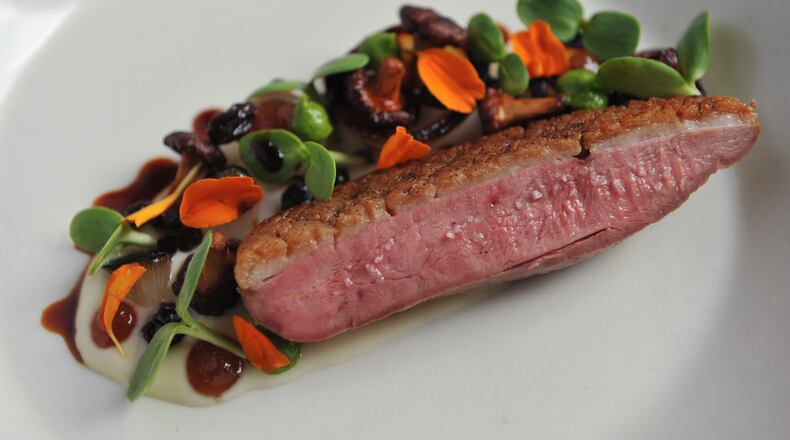 Long Island duck, Summerland Farm onions, preserved chanterelles and currants at Bacchanalia. (BECKY STEIN)