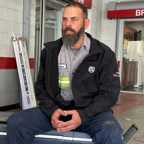 Adam Bowman, a supervisor at Grade A Auto Parts Recycling, is interviewed on Thursday, Nov. 13, 2025 in Louisville, Kentucky, about his actions after the UPS plane crash. (AP Photo/Dylan Lovan)