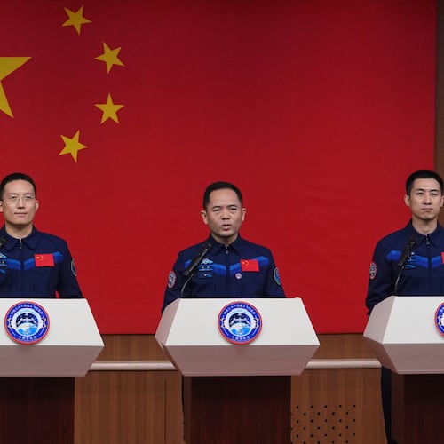 Astronauts for the upcoming Shenzhou 21 mission, from left, Zhang Hongzhang, Zhang Lu and Wu Fei attend a meeting with the press at the Jiuquan Satellite Launch Center in Jiuquan, northwest China, Thursday, Oct. 30, 2025. (AP Photo/Andy Wong)