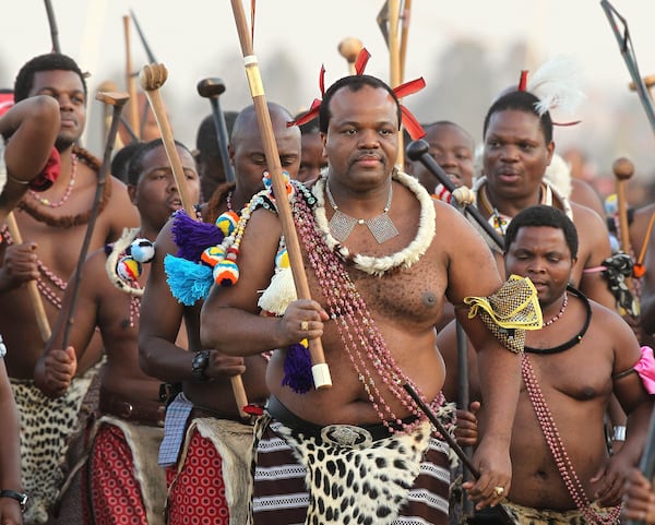 FILE - Eswatini's King, Mswati III, front, dances during a Reed Dance in Mbabane, Monday Sept. 3, 2012. (AP Photo/Themba Hadebe, File)