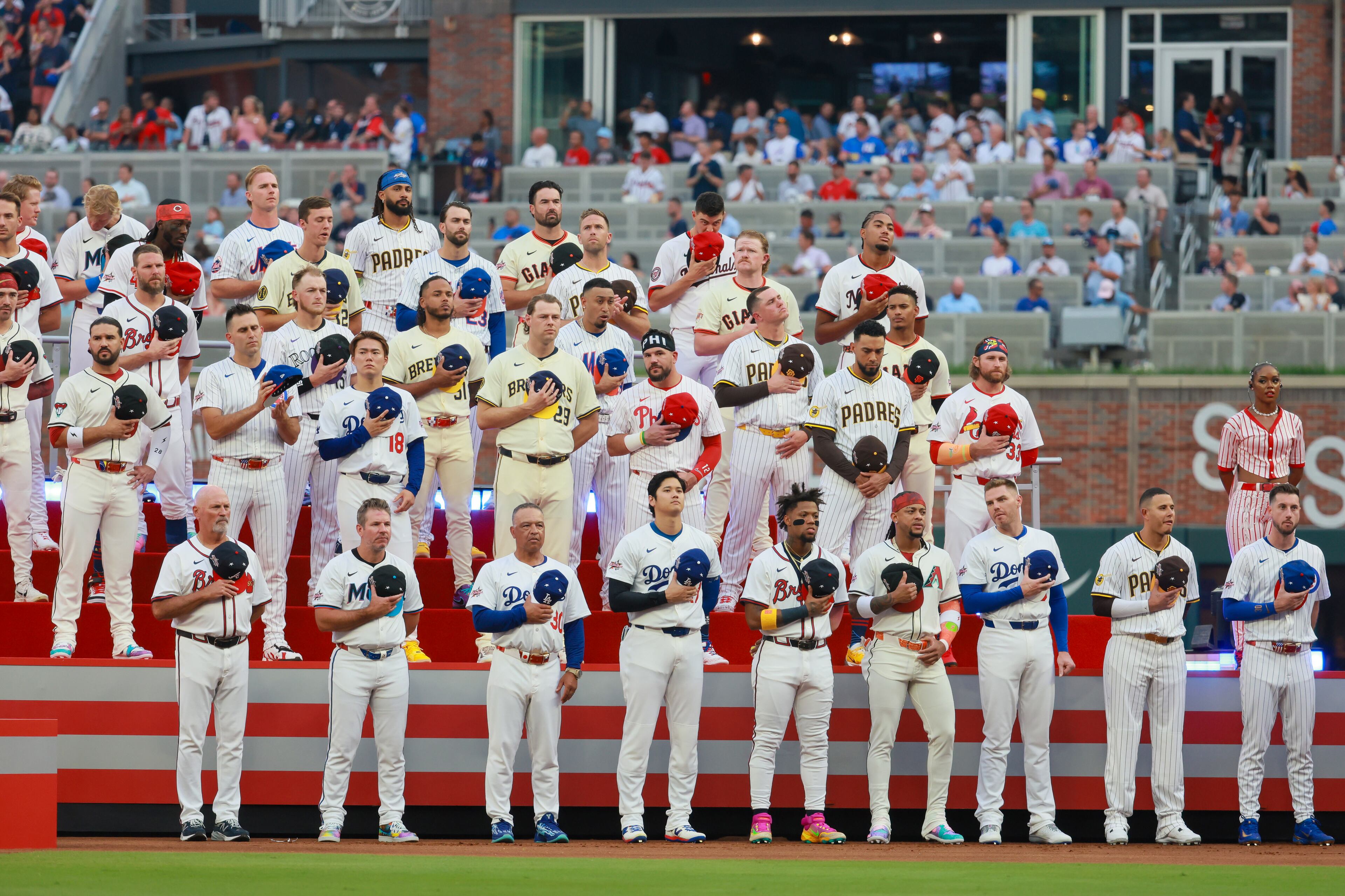 National League players sing the US national anthem during the MLB All-Star Game at Truist Park in Atlanta on Tuesday, July 15, 2025. (Jason Getz/AJC)